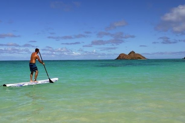 man paddle boarding